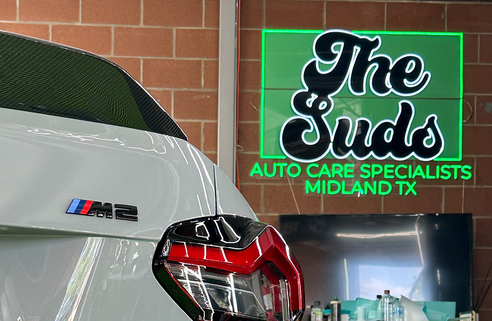 a BMW getting paint protection film by the suds in midland tx