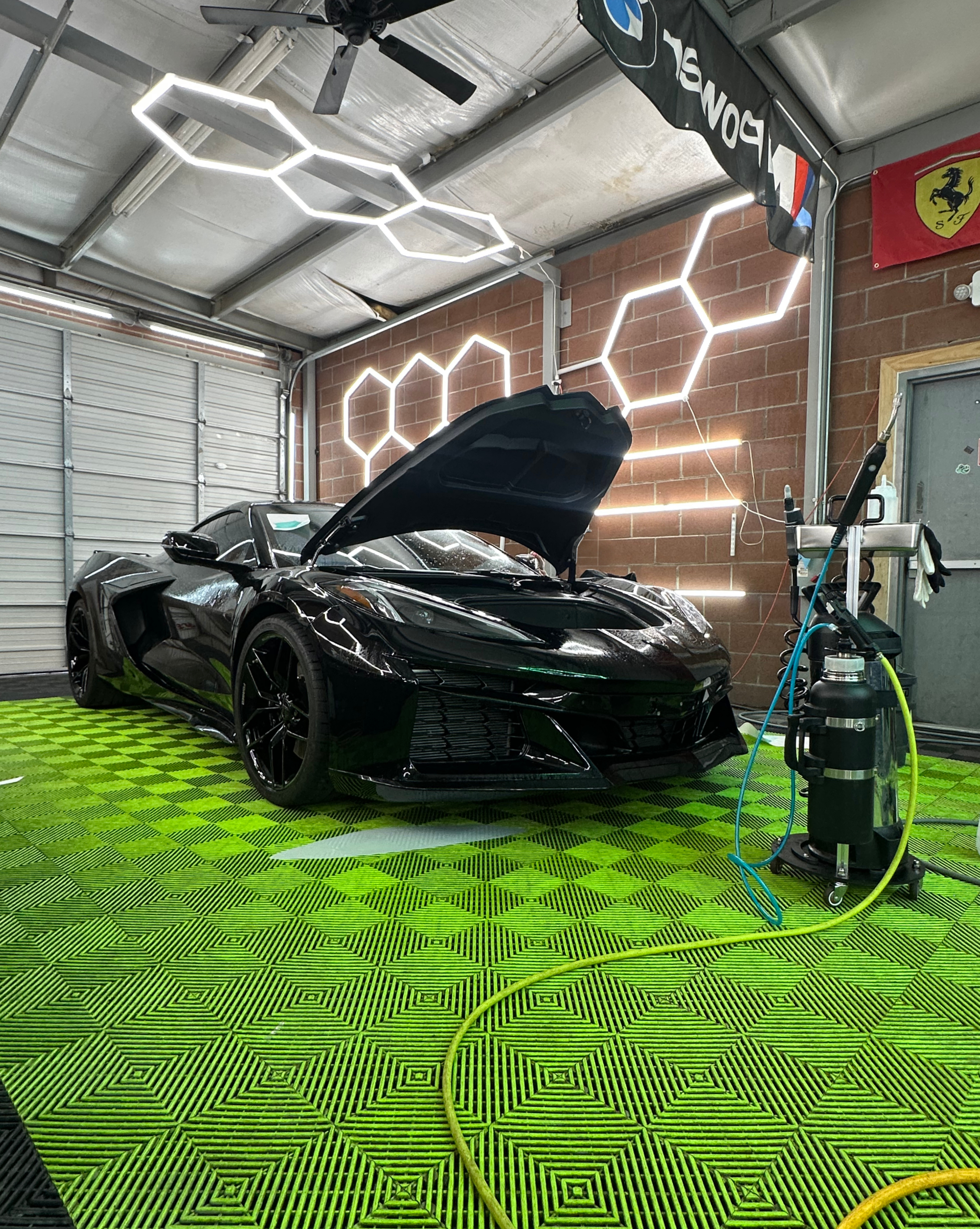 Black Corvette protected at The Suds auto care studio in Midland