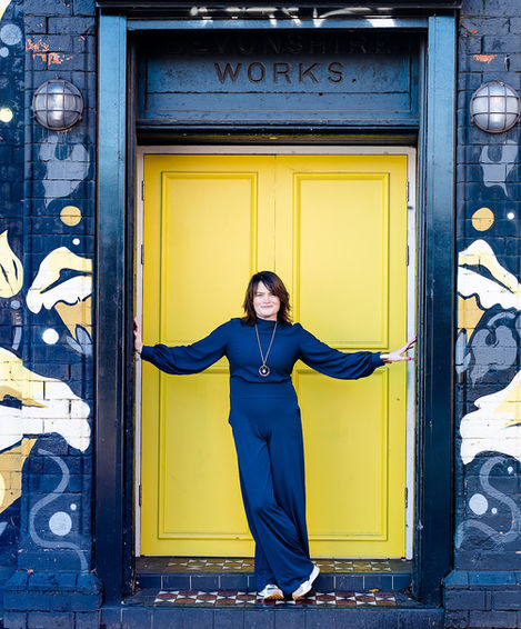 Personal branding photograph of a woman in a location connected to her business