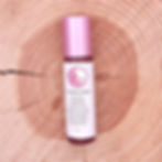 GMG's Connection Essential Oil Roll-On Bottle Front View with Wood Background