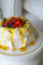 Pavlova with passionfruit curd and berries