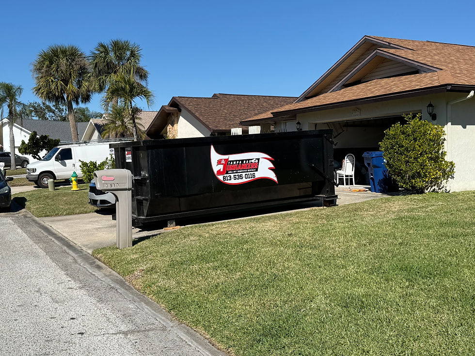 High angle view of a dumpster being loaded with construction debris