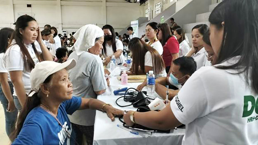 Bringing Services Closer. Indigenous Peoples of Donsol line up to process their civil documents at the Philippine Statistics Authority booth, while others avail services from various government agencies during the Information Cum Serbisyo Caravan. (Photo: PIA Sorsogon)