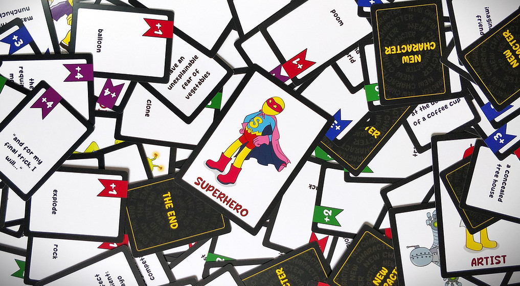 STEERY party game cards laid out showing character cards and story prompt cards - replayable storytelling game