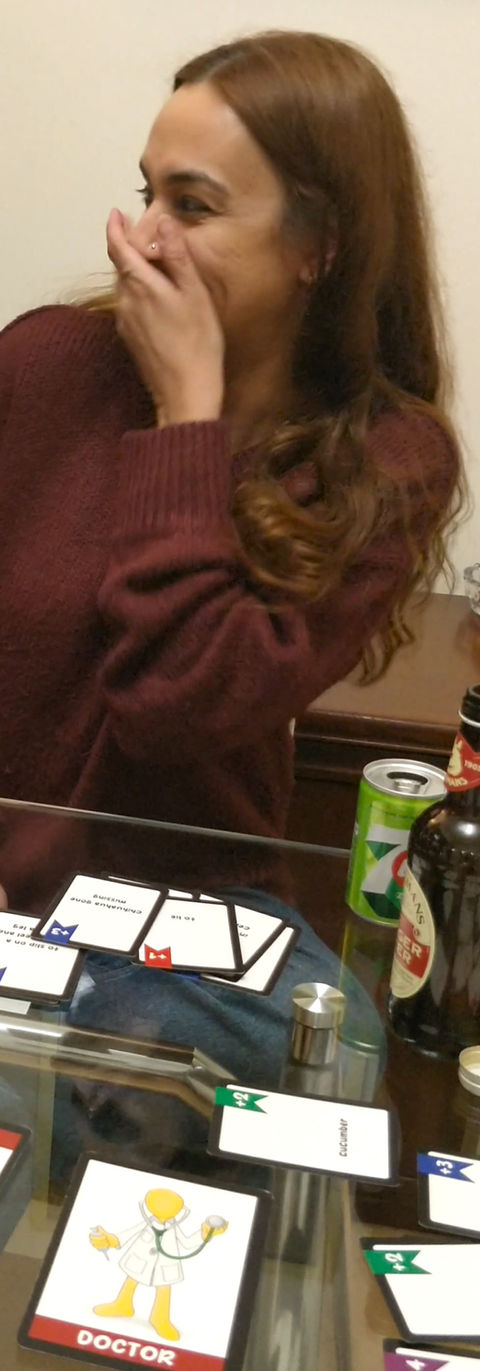 Players laughing awkwardly at STEERY party game story - genuine reactions at gaming convention