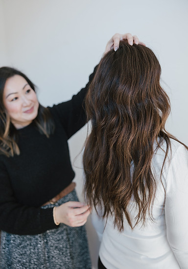 hair stylist showing off lived in, low maintenance hair color