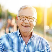 An-Elderly-Man-with-Glasses-Laughing.jpe