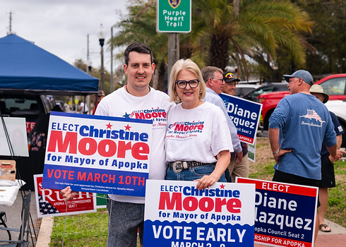 Christine-Moore-poses-with-her-son-during-early-voting.-Photo-by-Dana-OConnor-1024x731.png