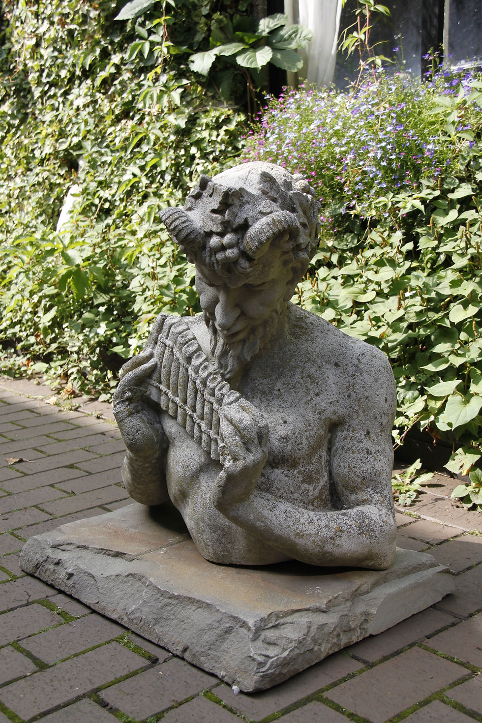 Thumbnail: Pan! Full of Character, playing his flute. Bust.