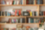 Bookshelf wealth promotes the display of storied knickknacks.