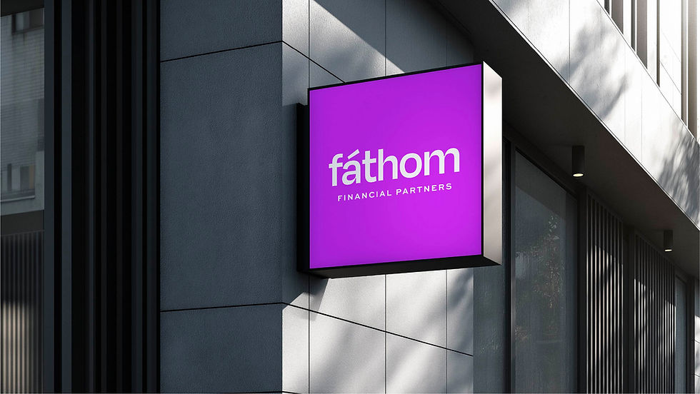 Fathom Financial Partners signage mounted on a modern building exterior using the purple and navy brand colors.
