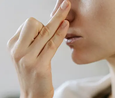 Woman practicing calming breathing exercises during the Fall Nervous System Reset online series.