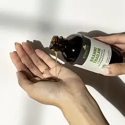 A brown bottle of Brahmi Oil from Athreya Herbs.