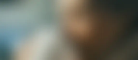 Woman drinking a cup of Triphala for digestion.