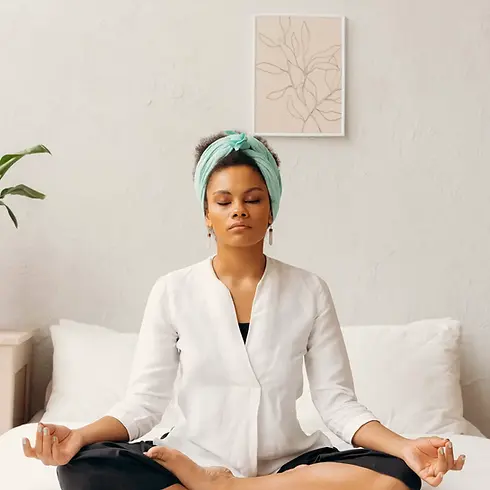 Woman sitting in silence and using the digestive audio support.