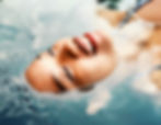Pitta dosha symptoms: woman floating in cool water to help reduce a pitta imbalance
