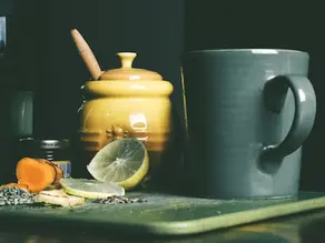Ayurvedic morning ritual with warm herbal tea and lemon to support the nervous system and digestion.