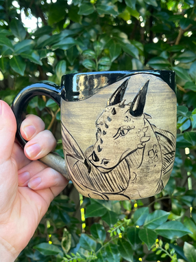Hand-made mug with hand-drawn dragon.