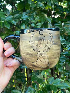 Hand-made mug with hand-painted deer.