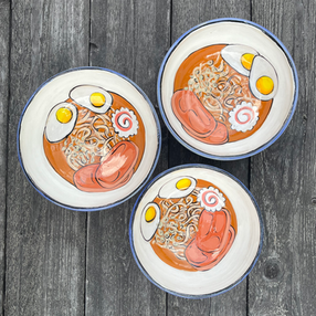 Pottery bowls with hand painting of ramen inside.