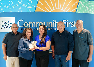 Photo of the October drawing winner, along with Community First management.