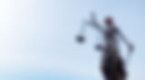 justitia-statue-with-red-blindfold-against-blue-sk-2024-12-06-21-40-01-utcD.jpg