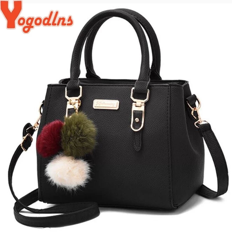 Yogodlns black embossed shoulder bag with pompom pendant