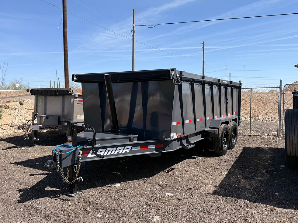 High angle view of a dump trailer being loaded with landscaping debris