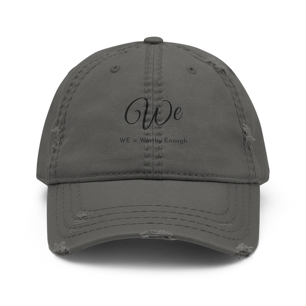 Distressed Otto Cap 104-1018 dad hat with 'WE' embroidery.