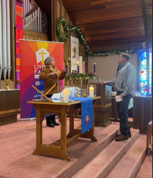 John and Peg McAllister lit the first two Advent candles.