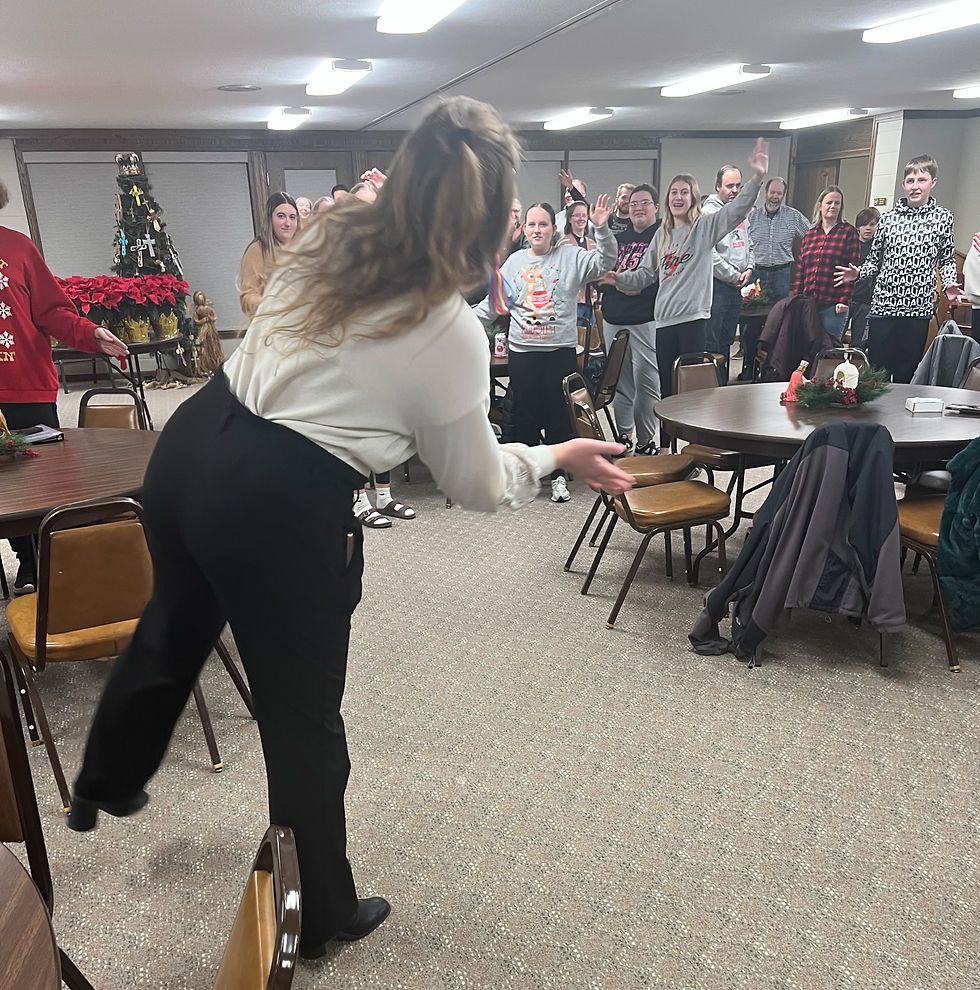 Pastor Paige leads a rousing table prayer before our meal!