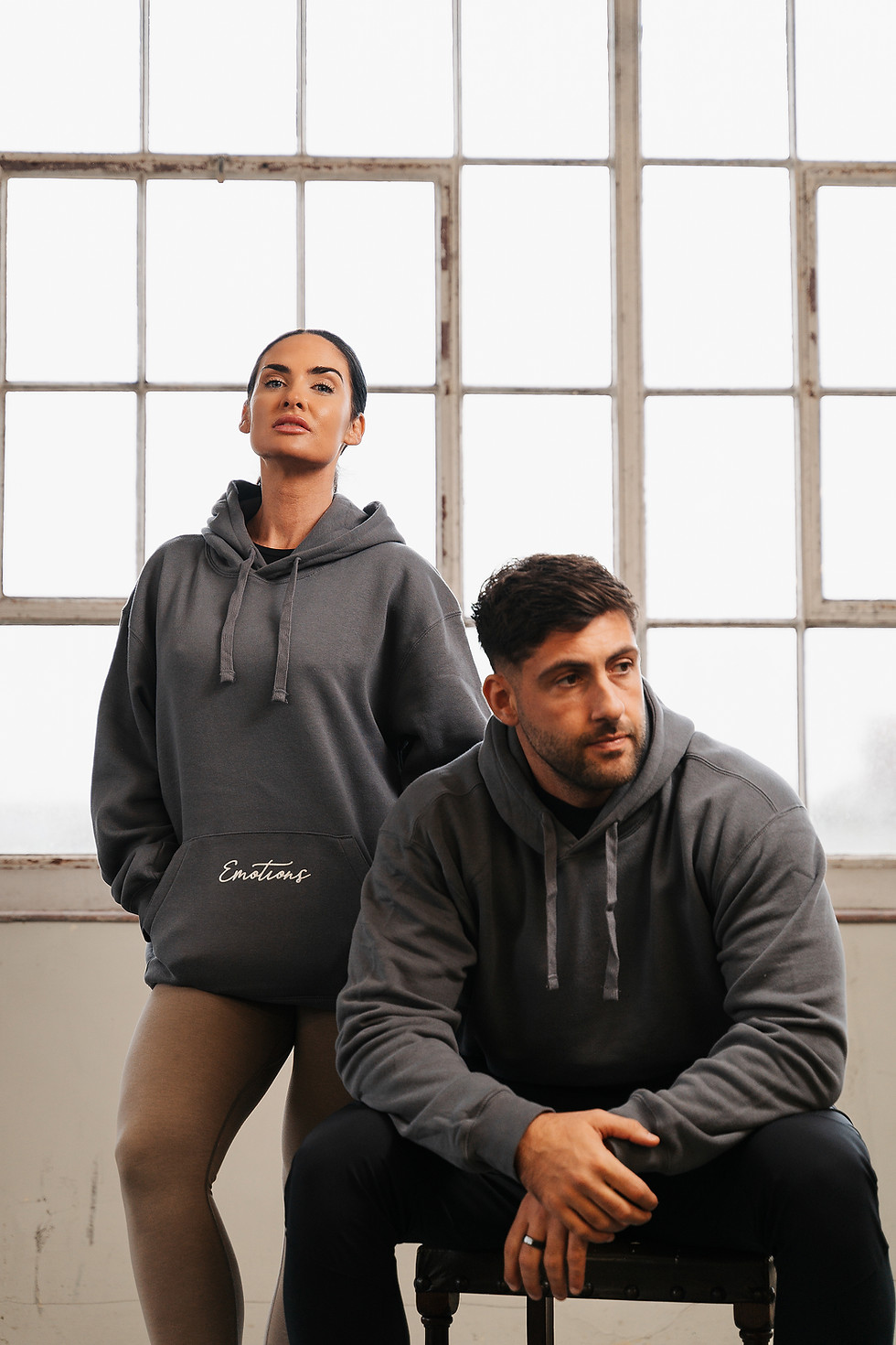 Grey everyday hoodie front view showing relaxed unisex fit and minimalist design