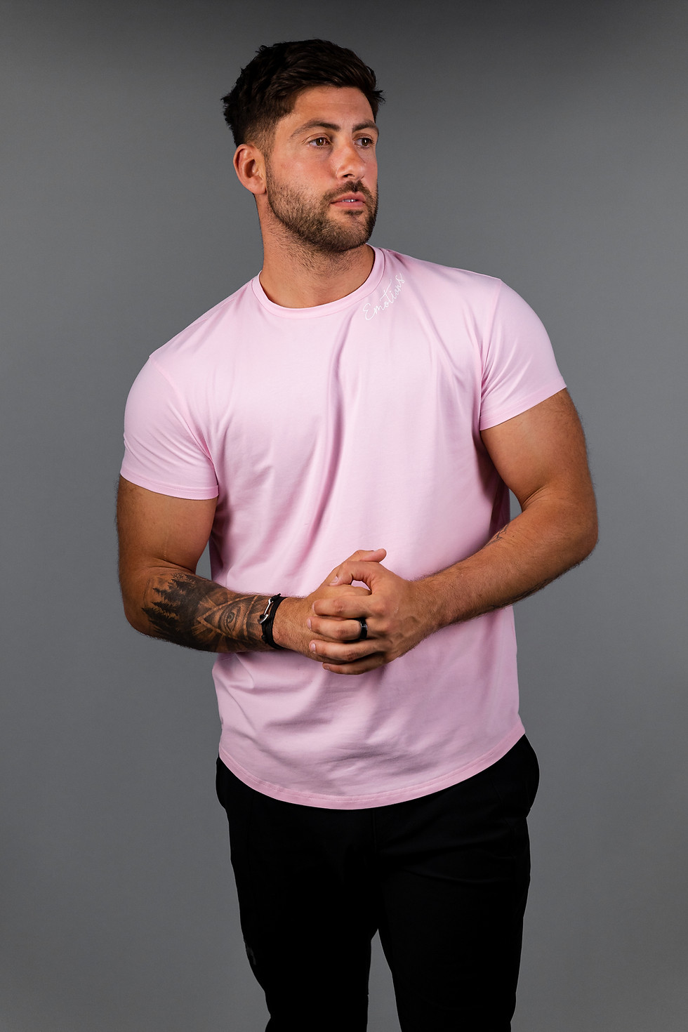 Pink fitted t-shirt front view showing fit and short sleeves
