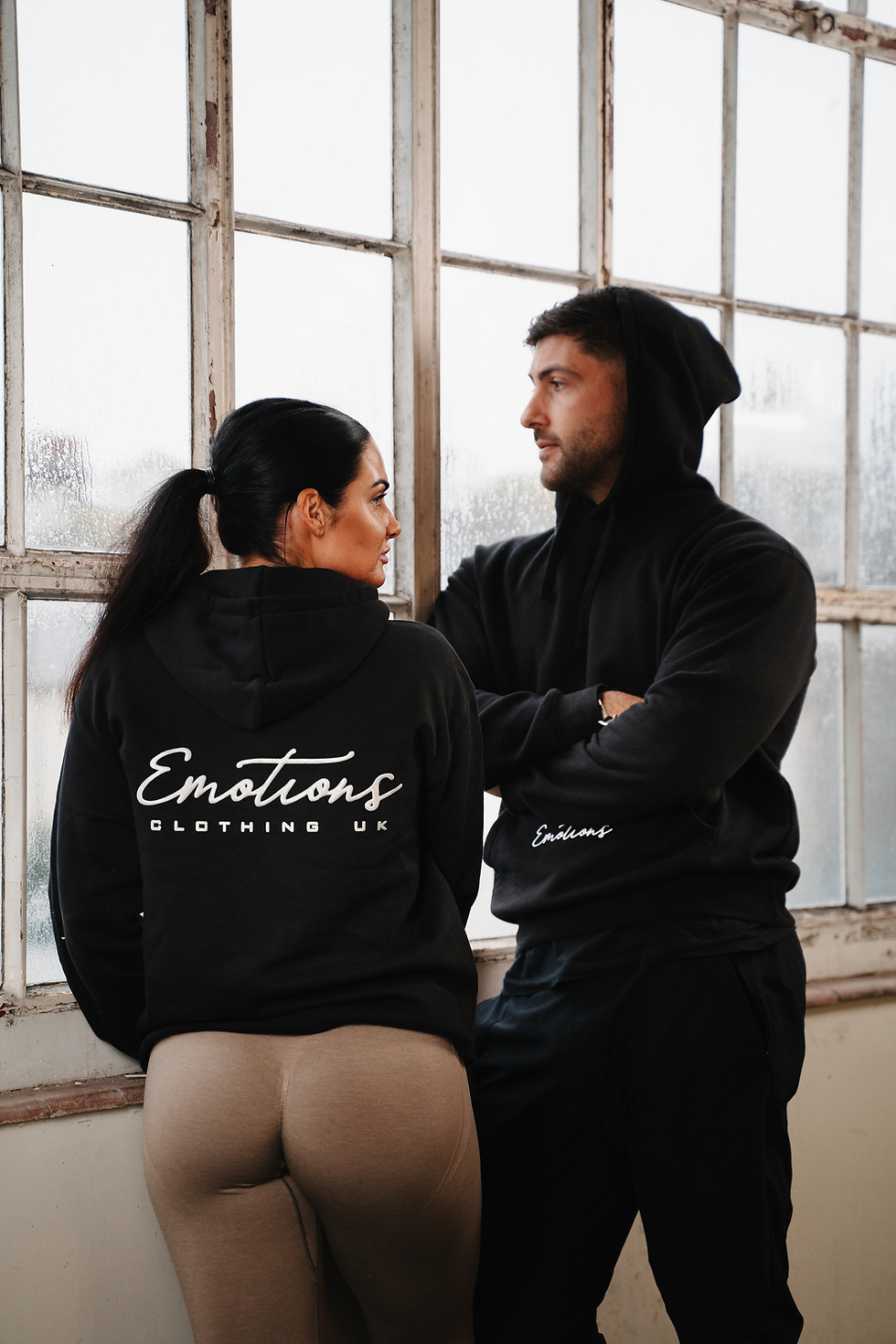 Lifestyle image of black everyday hoodie styled for casual streetwear