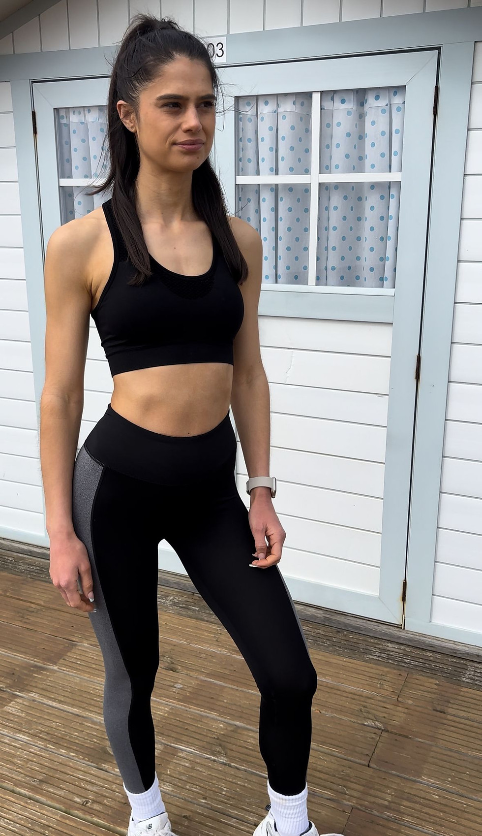 Motto sports bra front view showing supportive fit and athletic design