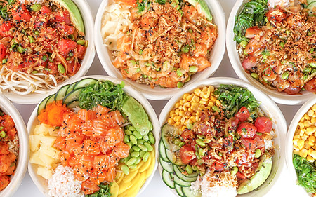 Seven of our signature poke bowls laid out