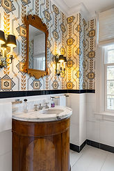 Wallpapered powder room with brass sconces, Litchfield CT