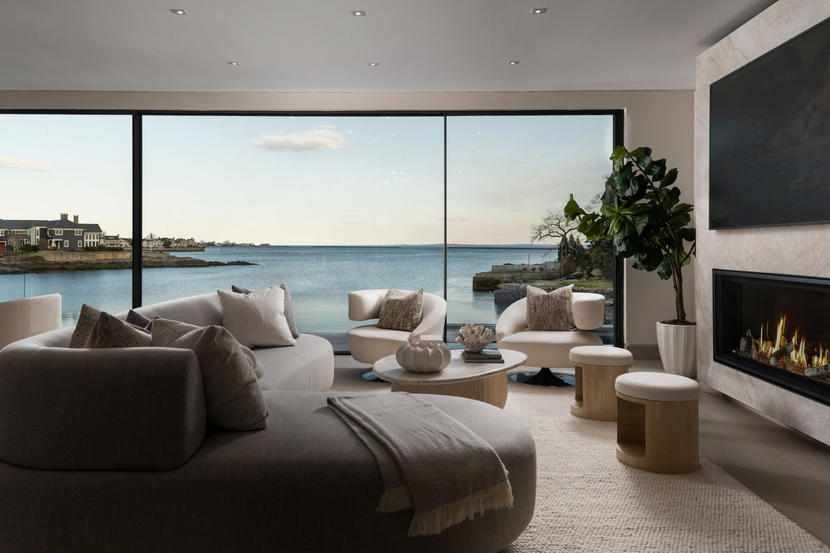 Waterfront living room with large windows