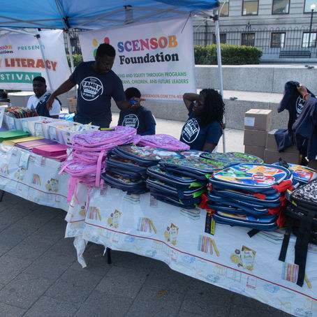 Family Literacy Festival Giveaway Table with Free School Supplies and Books