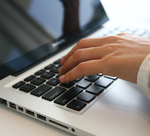 Hand on Laptop 