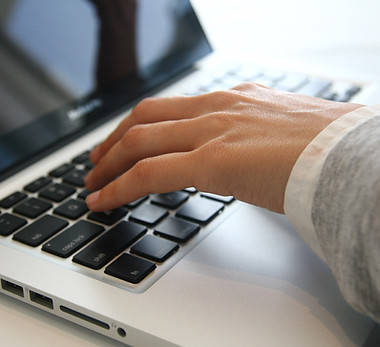 Hand on Laptop