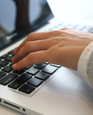 Hand on Laptop 