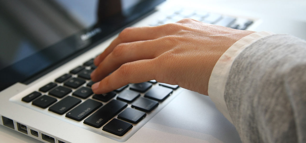 Hand on Laptop
