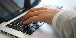 Hand on Laptop