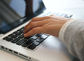 Hand on Laptop