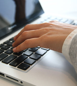 Hand on Laptop
