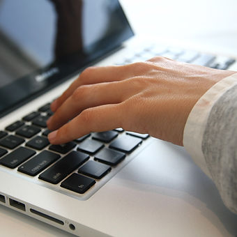 Hand on Laptop
