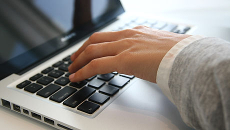 Hand on Laptop