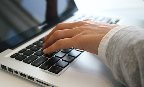 Hand on Laptop