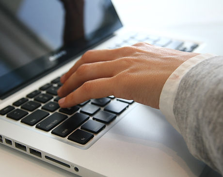 Hand on Laptop